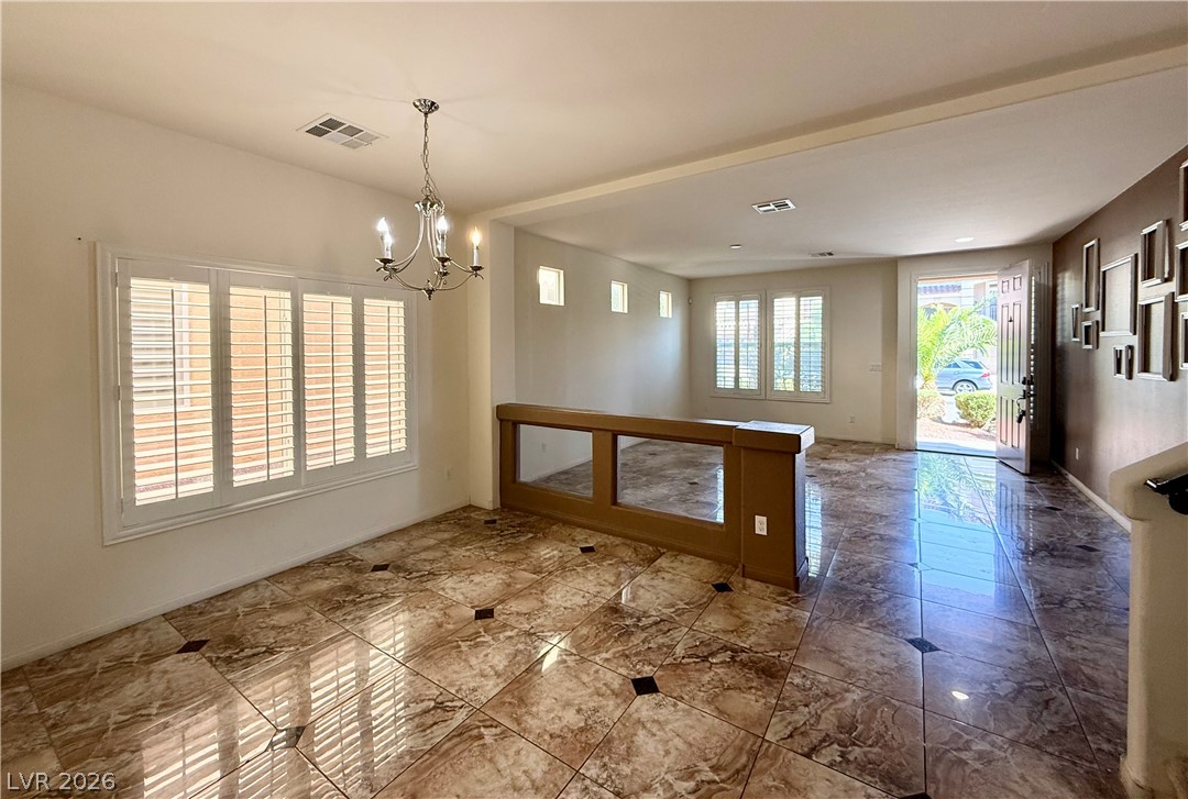 6459 Parrot Ridge Court Las Vegas, NV 89139 - Photo 22 of 23 Natural light illuminates this open floorplan, showcasing beautiful tile flooring throughout.