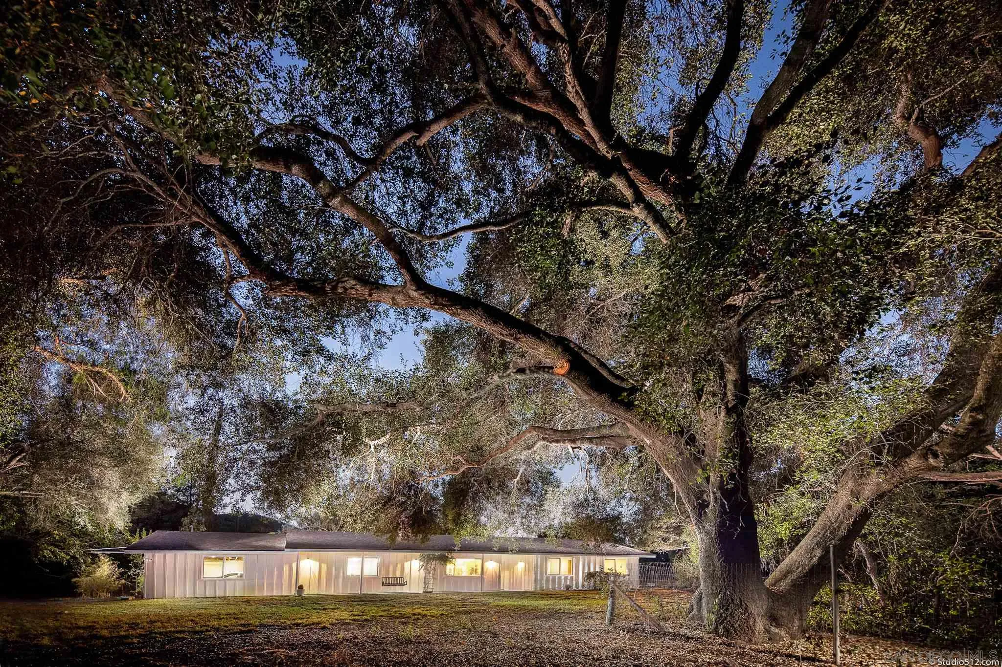 11425 Betsworth Road Valley Center, CA 92082 - Photo 1 of 24 a view of house with large trees