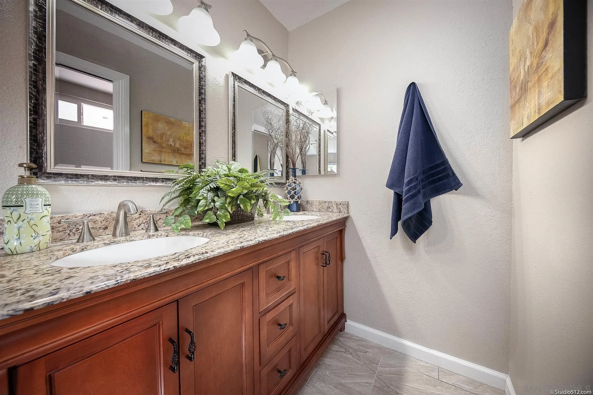 11425 Betsworth Road Valley Center, CA 92082 - Photo 16 of 24 a bathroom with a granite countertop sink and a mirror