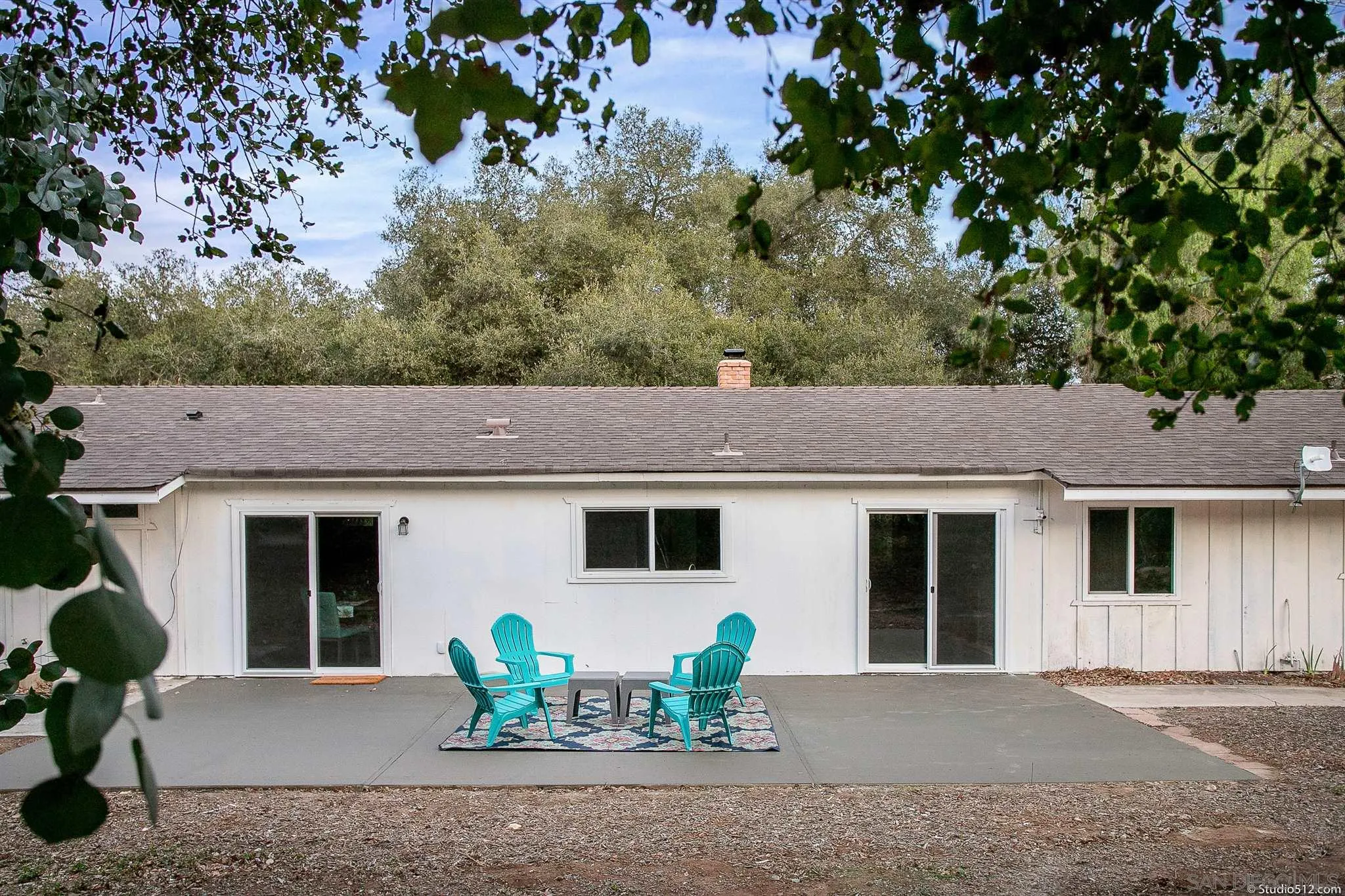 11425 Betsworth Road Valley Center, CA 92082 - Photo 19 of 24 a view of a house with a patio and a garden