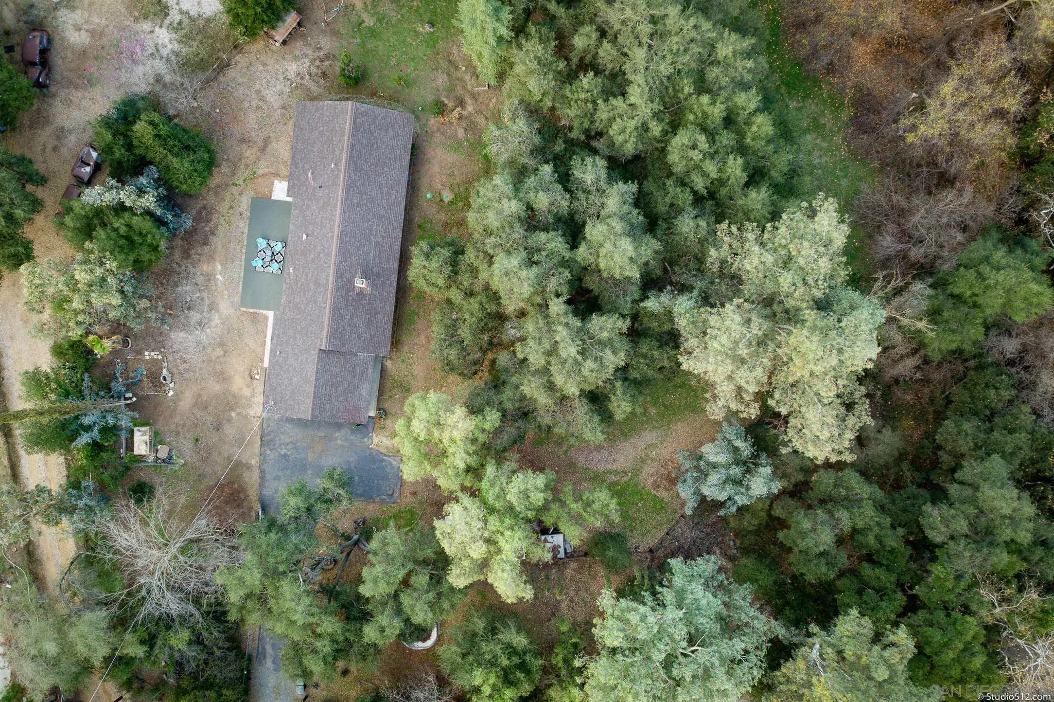 11425 Betsworth Road Valley Center, CA 92082 - Photo 3 of 24 an aerial view of a house with a yard and large trees