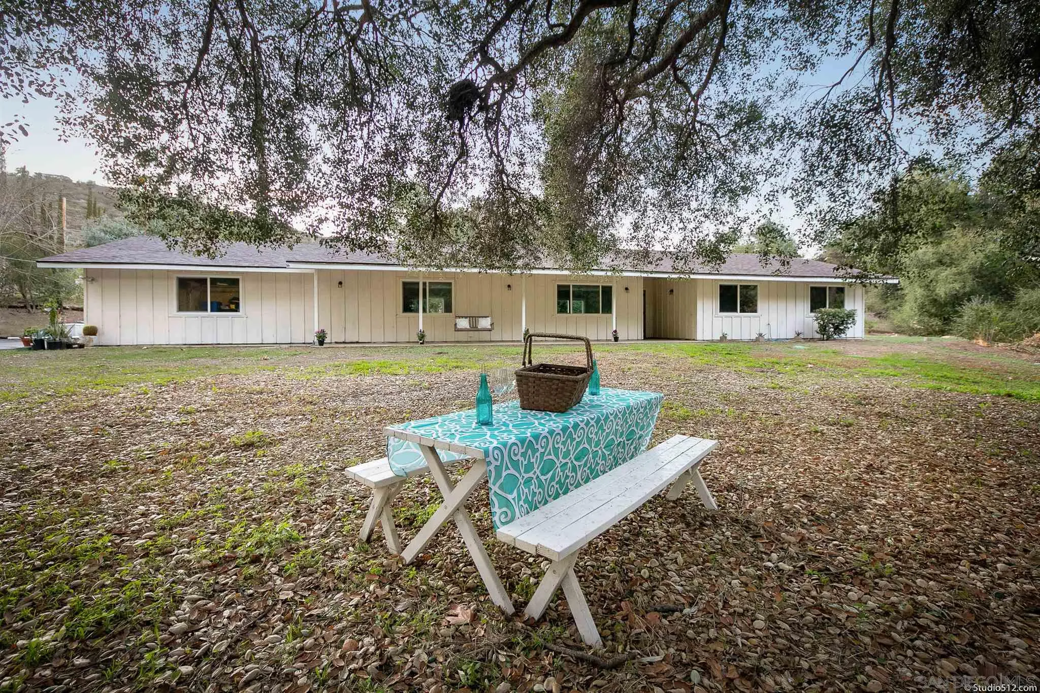 11425 Betsworth Road Valley Center, CA 92082 - Photo 4 of 24 a view of a backyard with table and chairs
