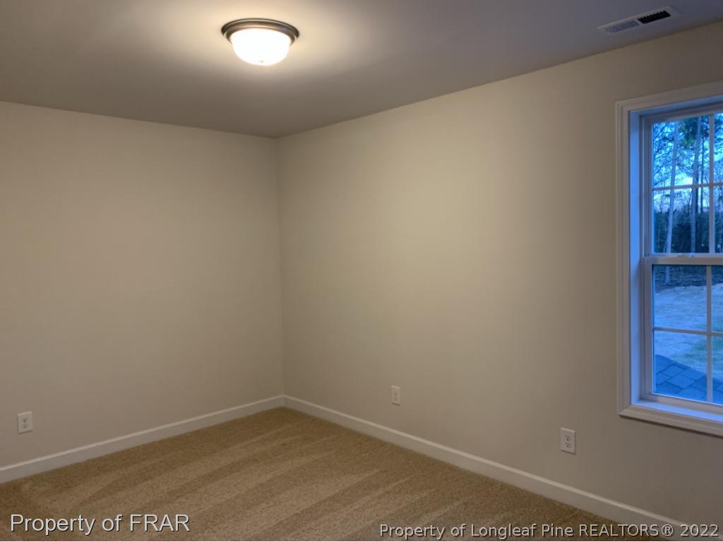865 Montrose Road Raeford, NC 28376 - Photo 17 of 21 an empty room with window