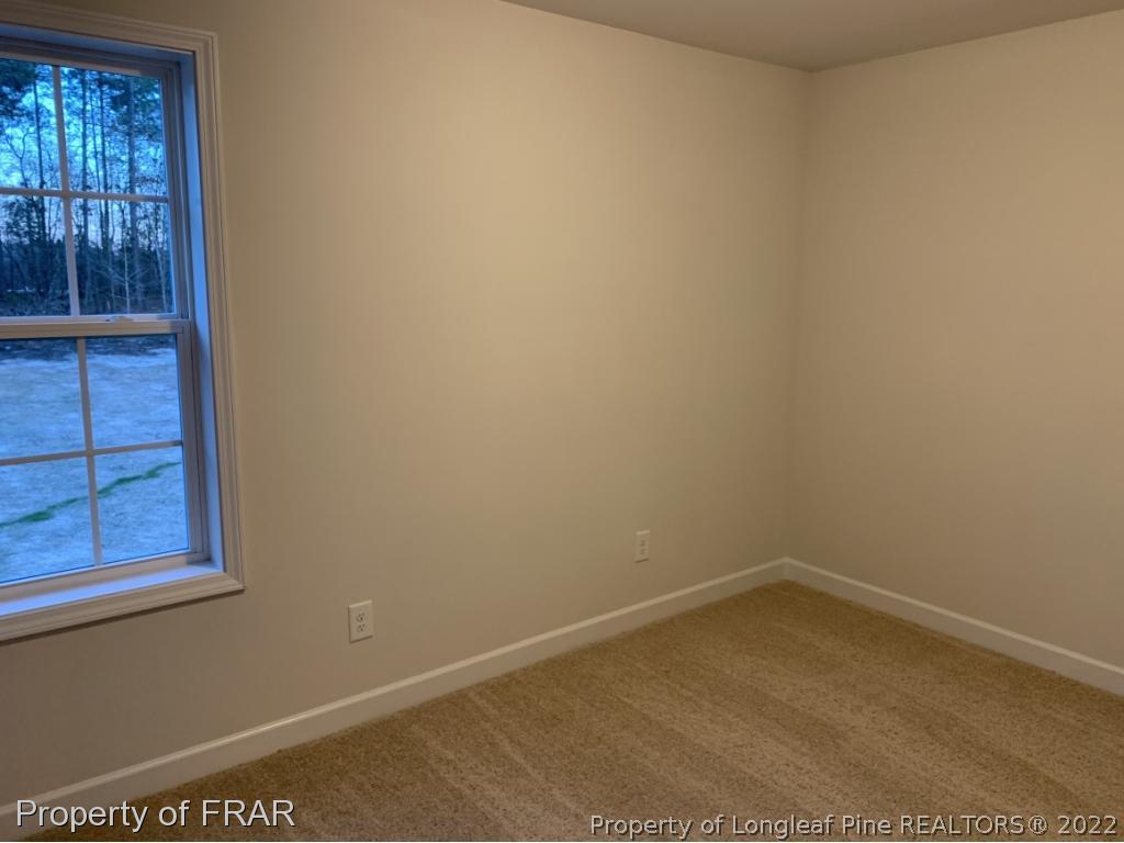 865 Montrose Road Raeford, NC 28376 - Photo 19 of 21 an empty room with windows