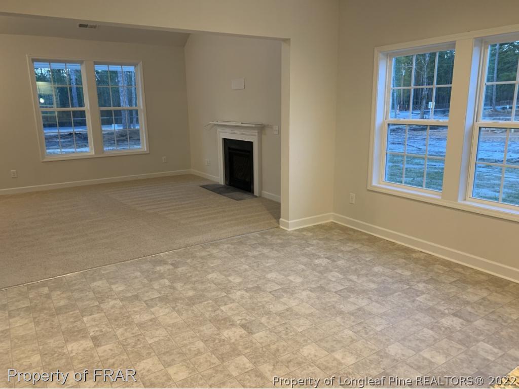865 Montrose Road Raeford, NC 28376 - Photo 9 of 21 an empty room with windows