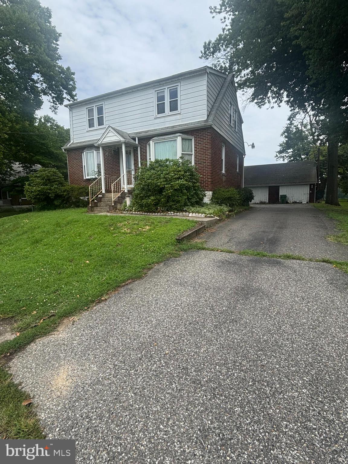 55 Repaupo Station Road Swedesboro, NJ 08085 - Photo 1 of 1 a front view of a house with a yard and trees