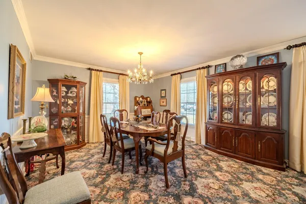 a view of a dining room with furniture window and outside view