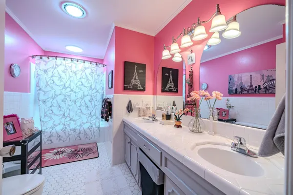 a bathroom with a sink vanity and a mirror