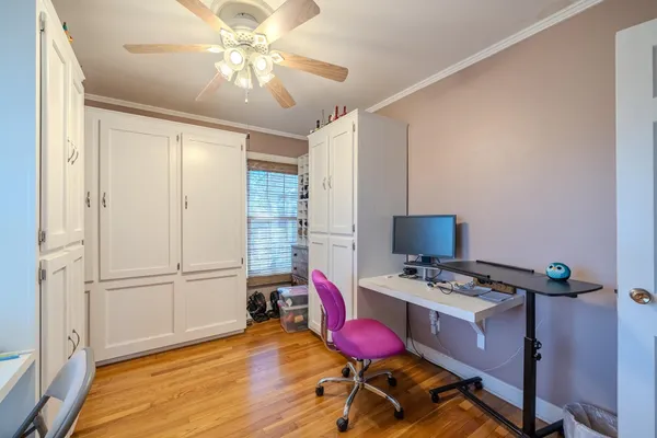 a workspace with furniture and wooden floor