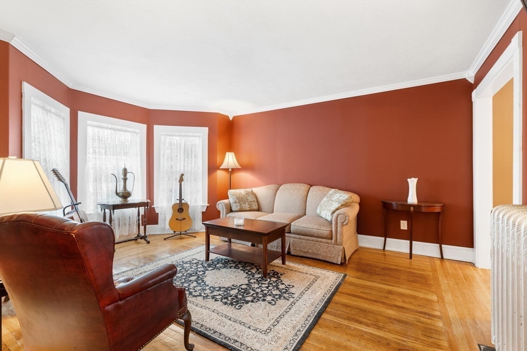 687 Main Street Wakefield, MA 01880 - Photo 11 of 36 a living room with furniture rug and a table