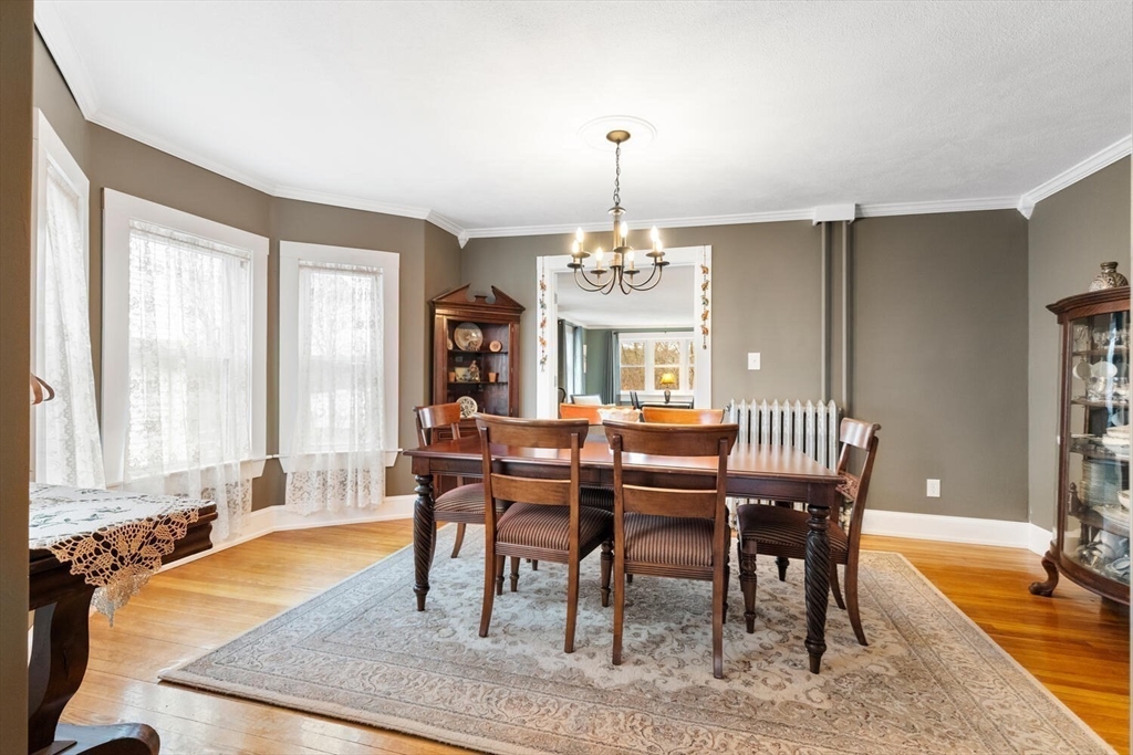 687 Main Street Wakefield, MA 01880 - Photo 12 of 36 a view of a dining room with furniture window and wooden floor