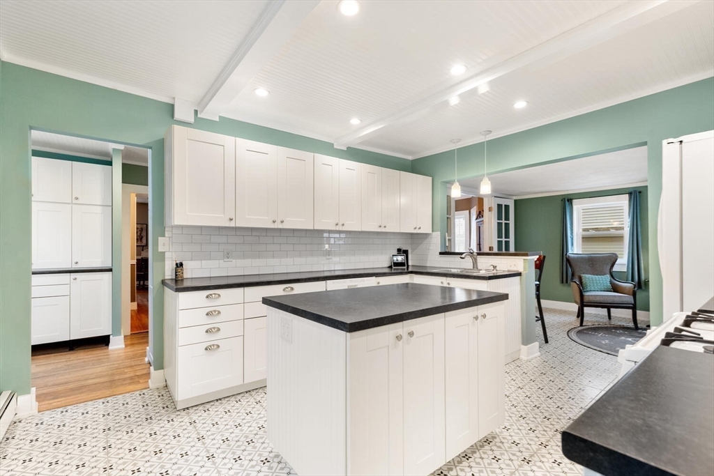687 Main Street Wakefield, MA 01880 - Photo 15 of 36 a kitchen with a sink stove and cabinets