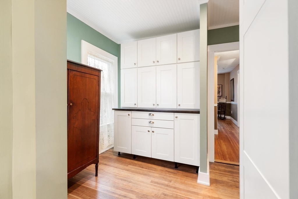 687 Main Street Wakefield, MA 01880 - Photo 19 of 36 a view of walk in closet with wooden floor