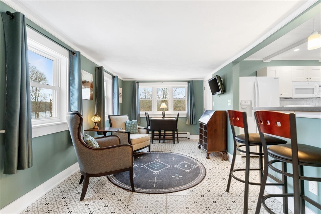 687 Main Street Wakefield, MA 01880 - Photo 20 of 36 a living room with furniture and a fireplace