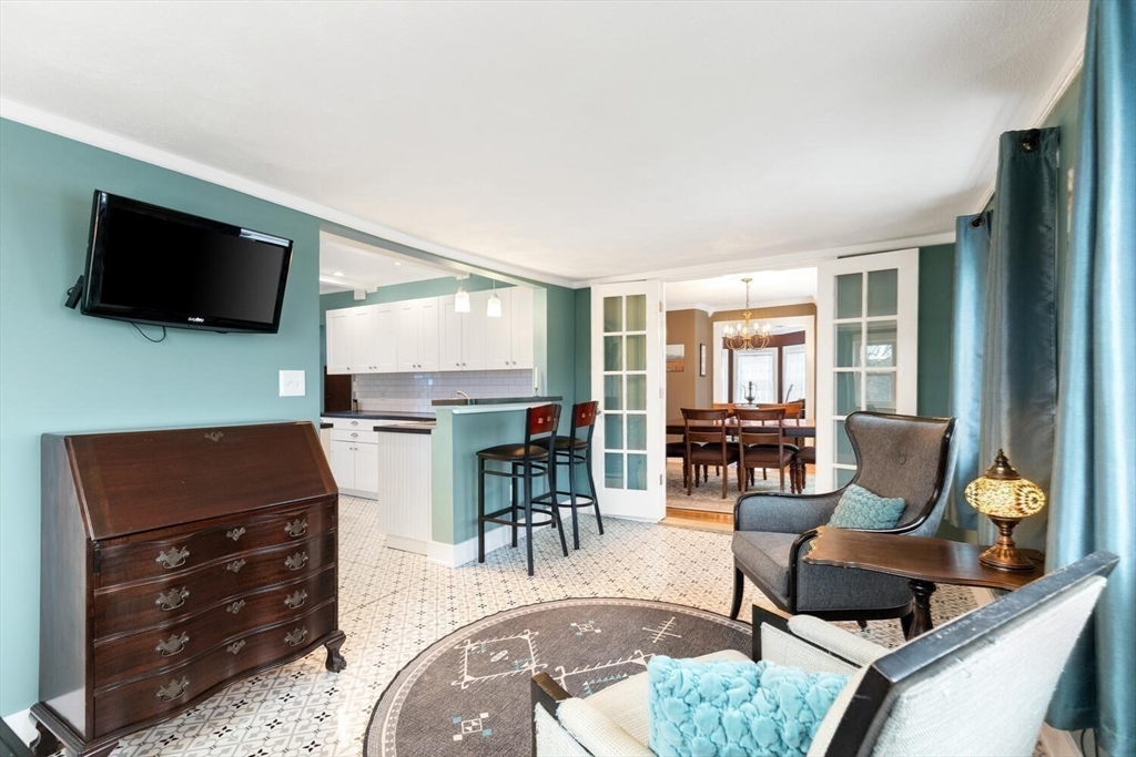 687 Main Street Wakefield, MA 01880 - Photo 21 of 36 a living room with furniture and a flat screen tv