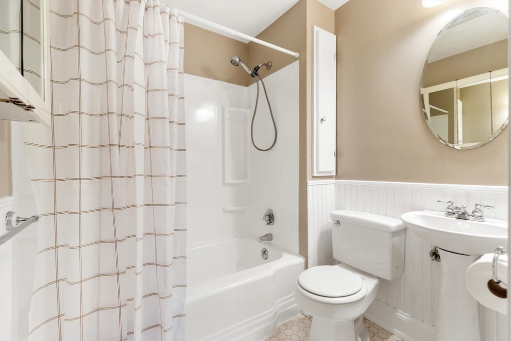 687 Main Street Wakefield, MA 01880 - Photo 22 of 36 a bathroom with a sink toilet and shower