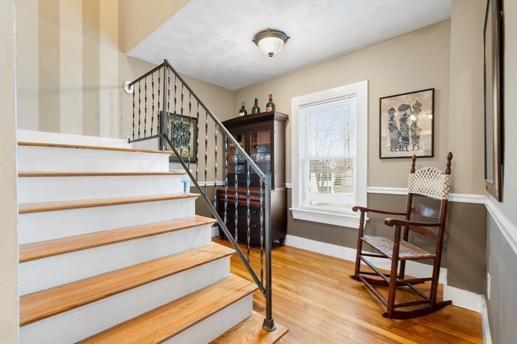 687 Main Street Wakefield, MA 01880 - Photo 23 of 36 a view of entryway dining room and hall with wooden floor