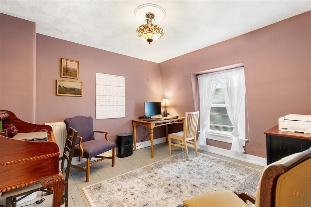 687 Main Street Wakefield, MA 01880 - Photo 26 of 36 a living room with furniture and a window