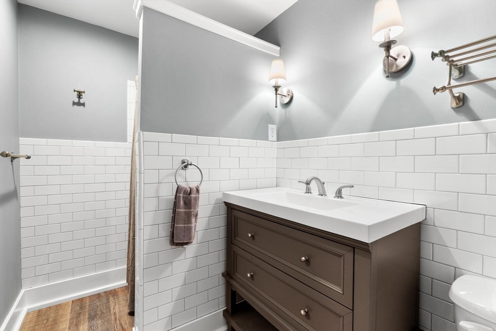 687 Main Street Wakefield, MA 01880 - Photo 31 of 36 a bathroom with a sink and a mirror