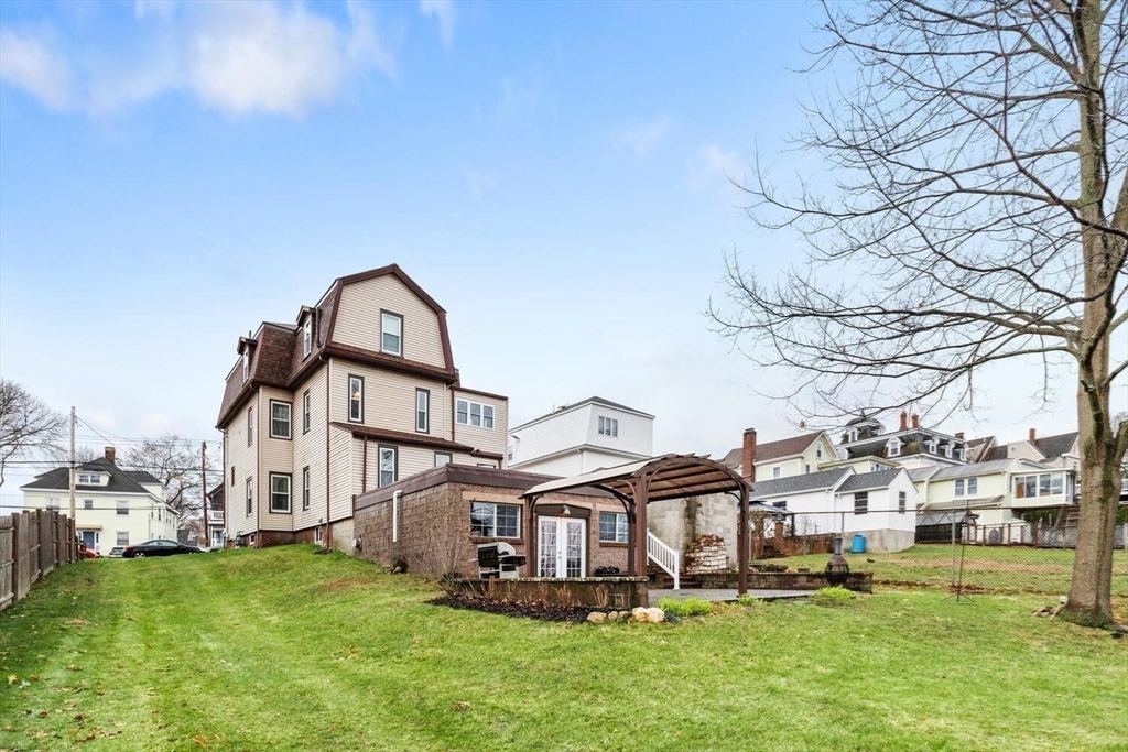 687 Main Street Wakefield, MA 01880 - Photo 33 of 36 a front view of a house with a garden