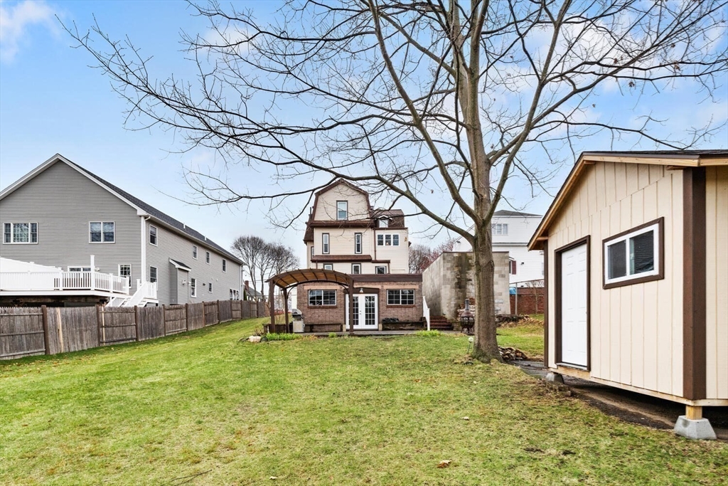687 Main Street Wakefield, MA 01880 - Photo 34 of 36 a front view of a house with a yard
