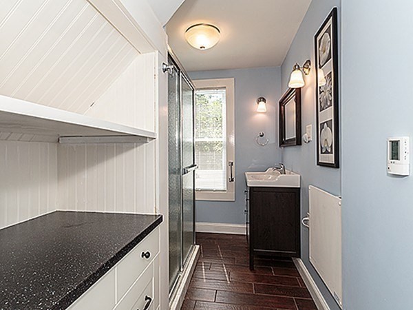687 Main Street Wakefield, MA 01880 - Photo 8 of 36 a bathroom with a sink vanity and a mirror
