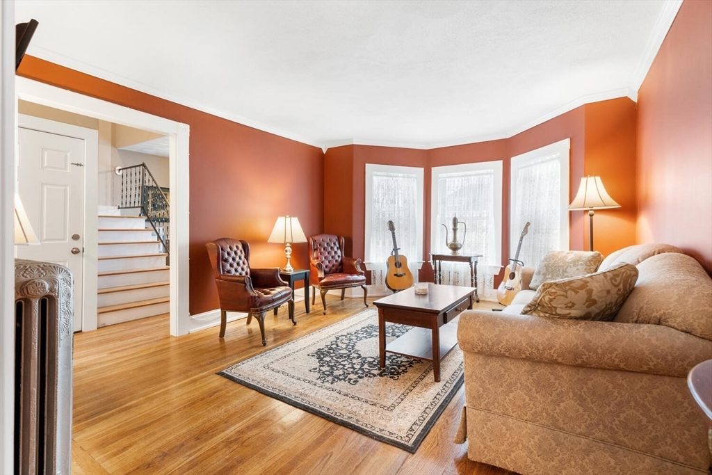 687 Main Street Wakefield, MA 01880 - Photo 10 of 36 a living room with furniture and a table