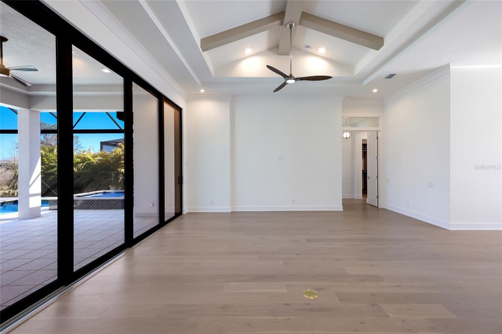 1107 Blue Shell Loop Sarasota, FL 34240 - Photo 11 of 88 a view of a hallway with a glass door and chandelier