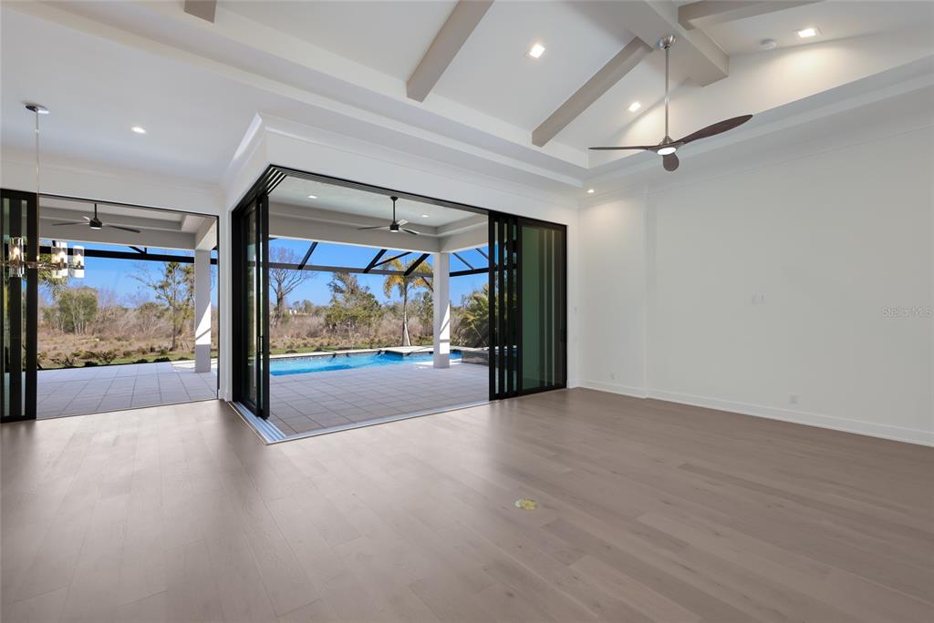 1107 Blue Shell Loop Sarasota, FL 34240 - Photo 18 of 88 a view of gallery with a floor to ceiling window