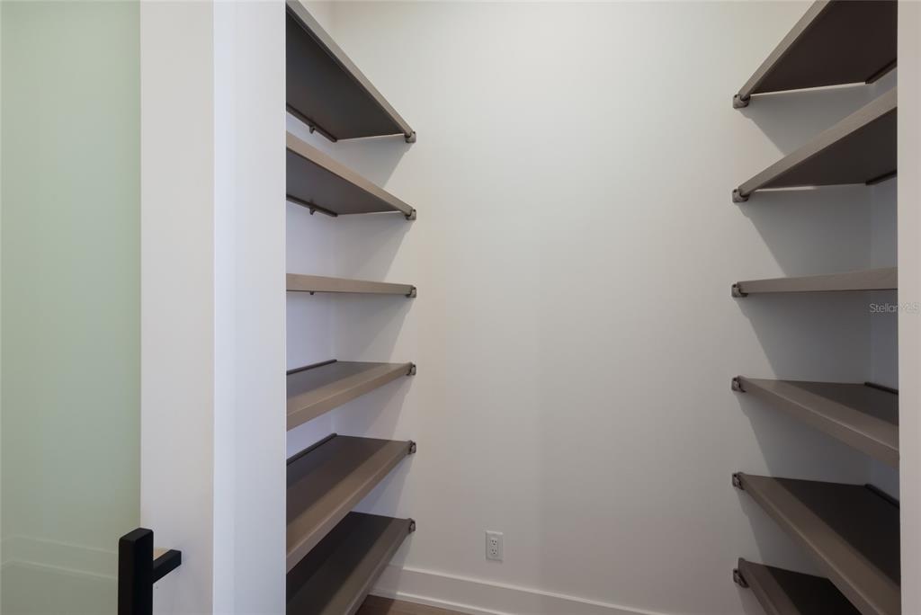 1107 Blue Shell Loop Sarasota, FL 34240 - Photo 22 of 88 a view of walk in closet with empty racks