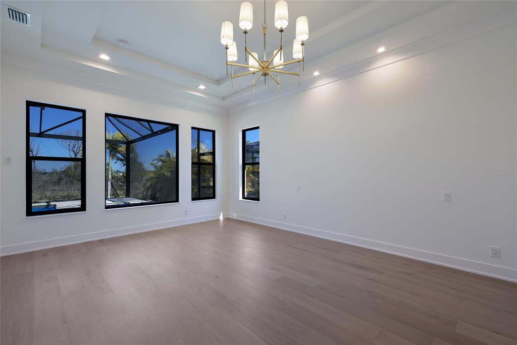 1107 Blue Shell Loop Sarasota, FL 34240 - Photo 26 of 88 a view of an empty room with glass door and a window