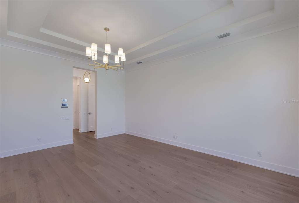 1107 Blue Shell Loop Sarasota, FL 34240 - Photo 28 of 88 wooden floor in an empty room