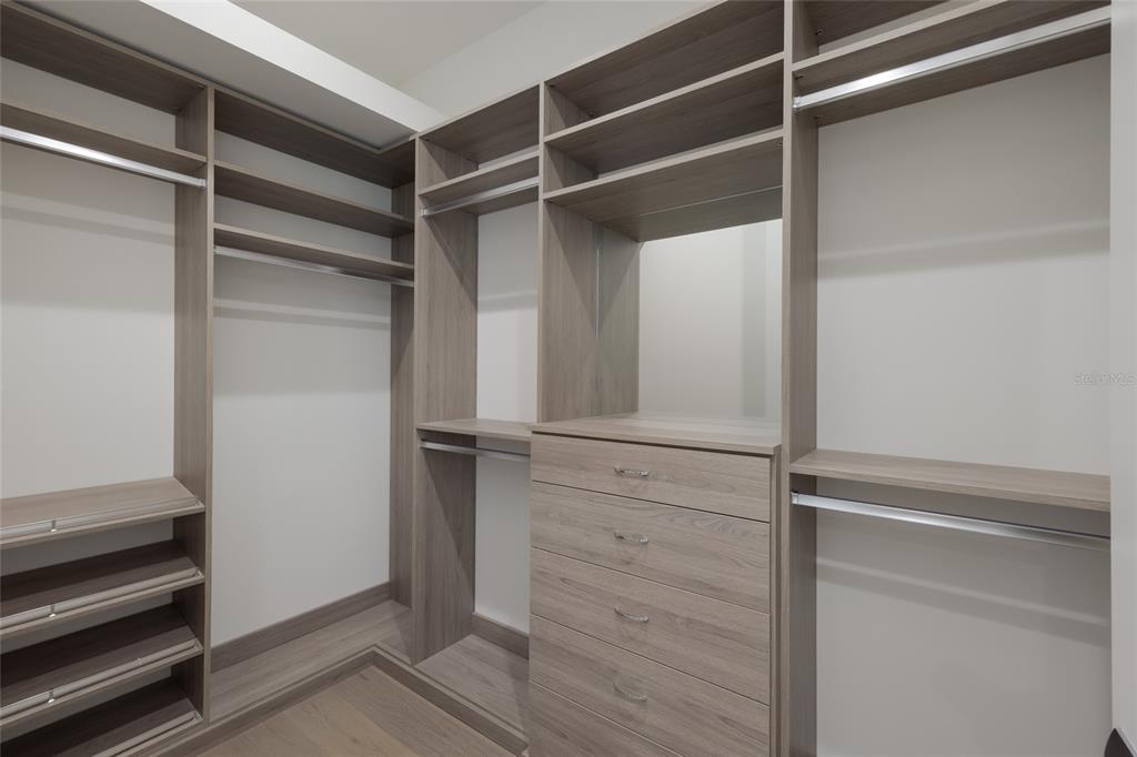 1107 Blue Shell Loop Sarasota, FL 34240 - Photo 29 of 88 a view of walk in closet with empty racks