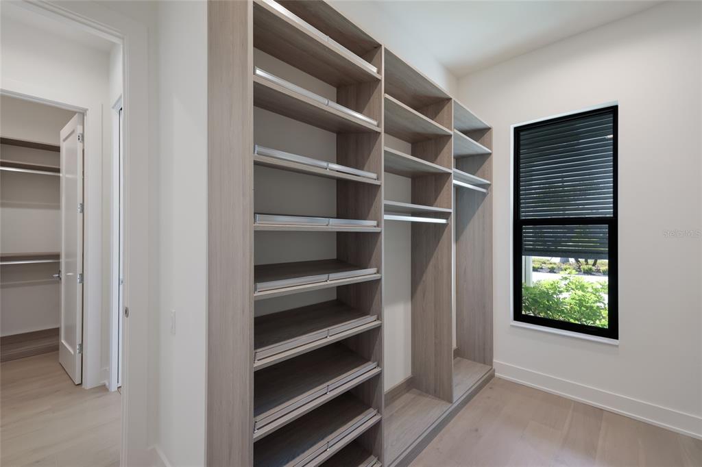 1107 Blue Shell Loop Sarasota, FL 34240 - Photo 31 of 88 a view of walk in closet with empty racks