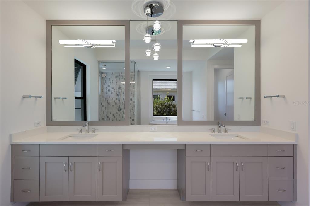1107 Blue Shell Loop Sarasota, FL 34240 - Photo 33 of 88 a bathroom with double sink and a mirror