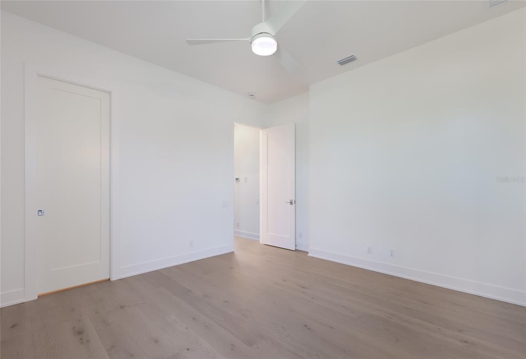 1107 Blue Shell Loop Sarasota, FL 34240 - Photo 40 of 88 a view of an empty room with a fan