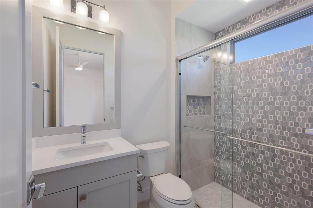 1107 Blue Shell Loop Sarasota, FL 34240 - Photo 41 of 88 a bathroom with a sink a toilet and shower
