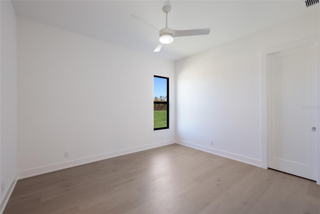 1107 Blue Shell Loop Sarasota, FL 34240 - Photo 42 of 88 an empty room with a window