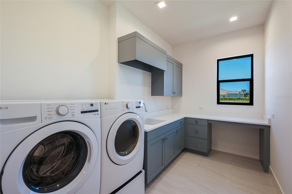 1107 Blue Shell Loop Sarasota, FL 34240 - Photo 46 of 88 a utility room with dryer and washer