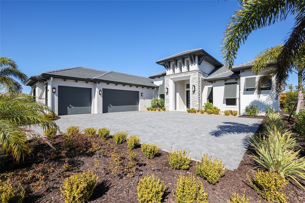 1107 Blue Shell Loop Sarasota, FL 34240 - Photo 60 of 88 a front view of a house with a yard
