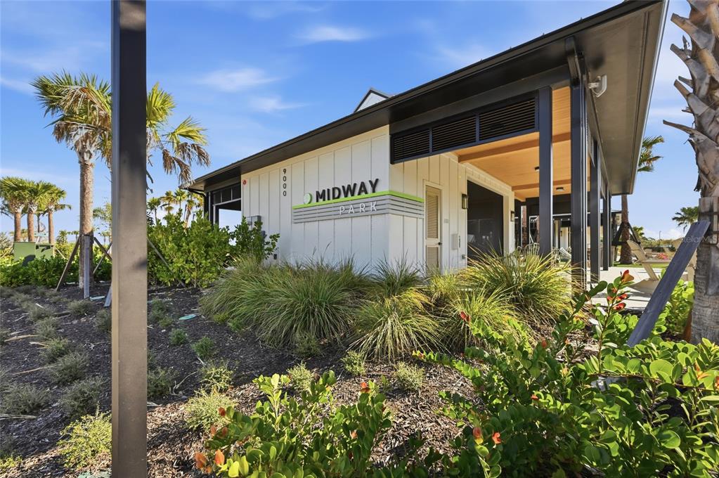 1107 Blue Shell Loop Sarasota, FL 34240 - Photo 65 of 88 a front view of a house with garden