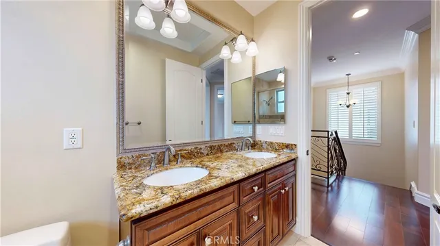 a bathroom with a tub a mirror and a shower