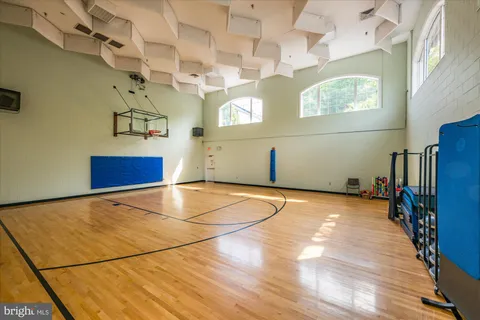 a room with gym equipment and windows