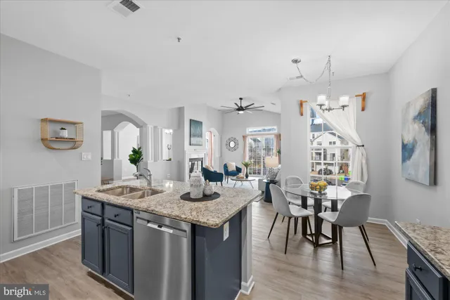 a living room with granite countertop furniture a dining table and chairs