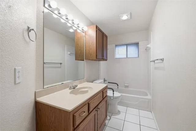 a bathroom with a sink a vanity and a mirror
