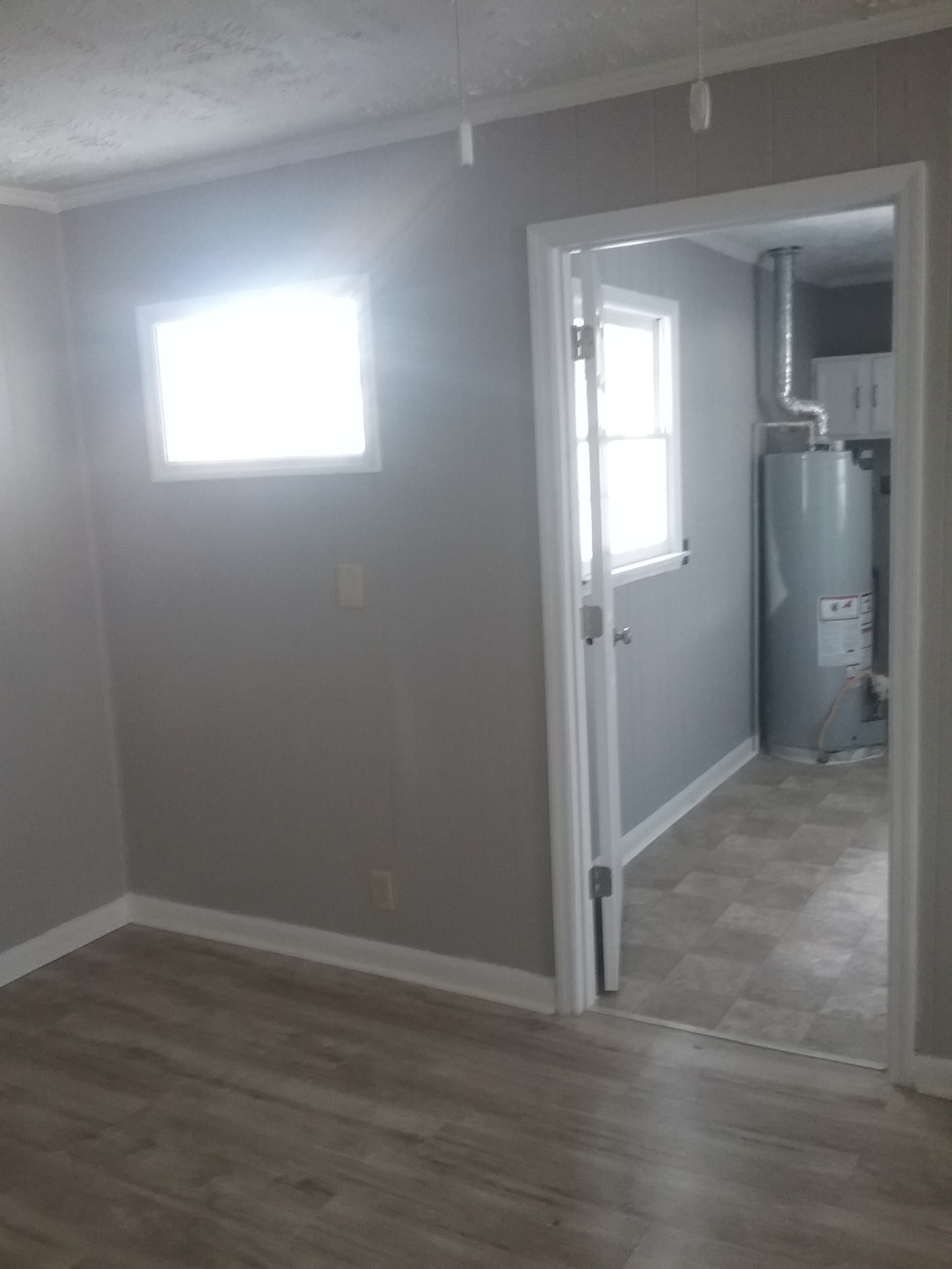 211 Locust Street Alexandria, TN 37012 - Photo 9 of 13 a view of empty room with wooden floor and fan