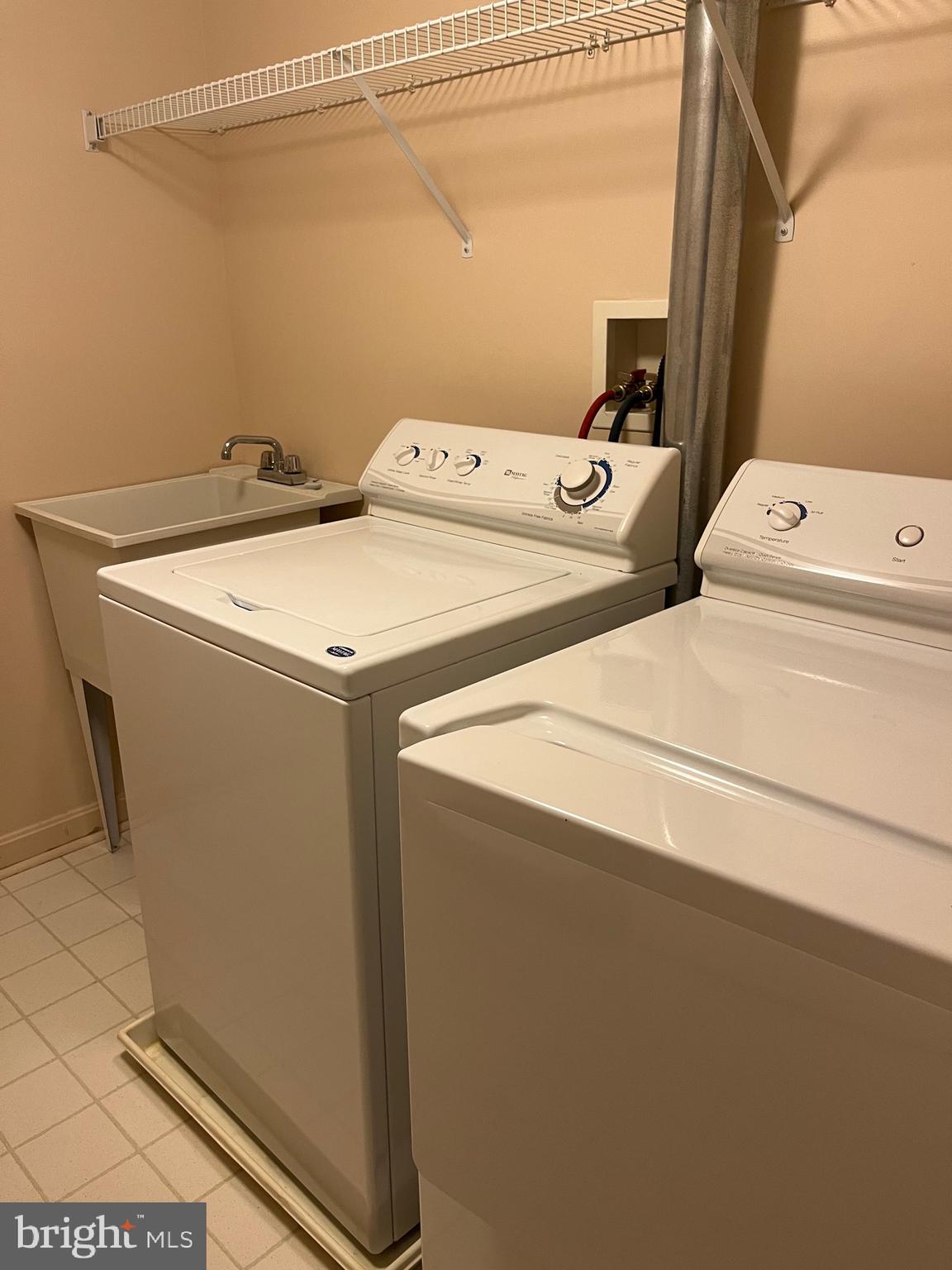 12320 Rosslare Ridge Road, Unit 506 Lutherville-Timonium, MD 21093 - Photo 41 of 49 Laundry room with utility sink