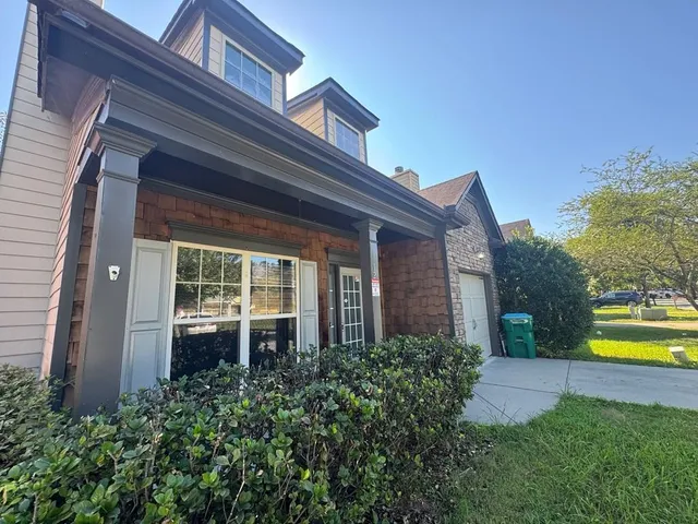 front view of a house with a swimming pool