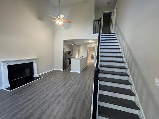 wooden floor in an empty room with a fireplace