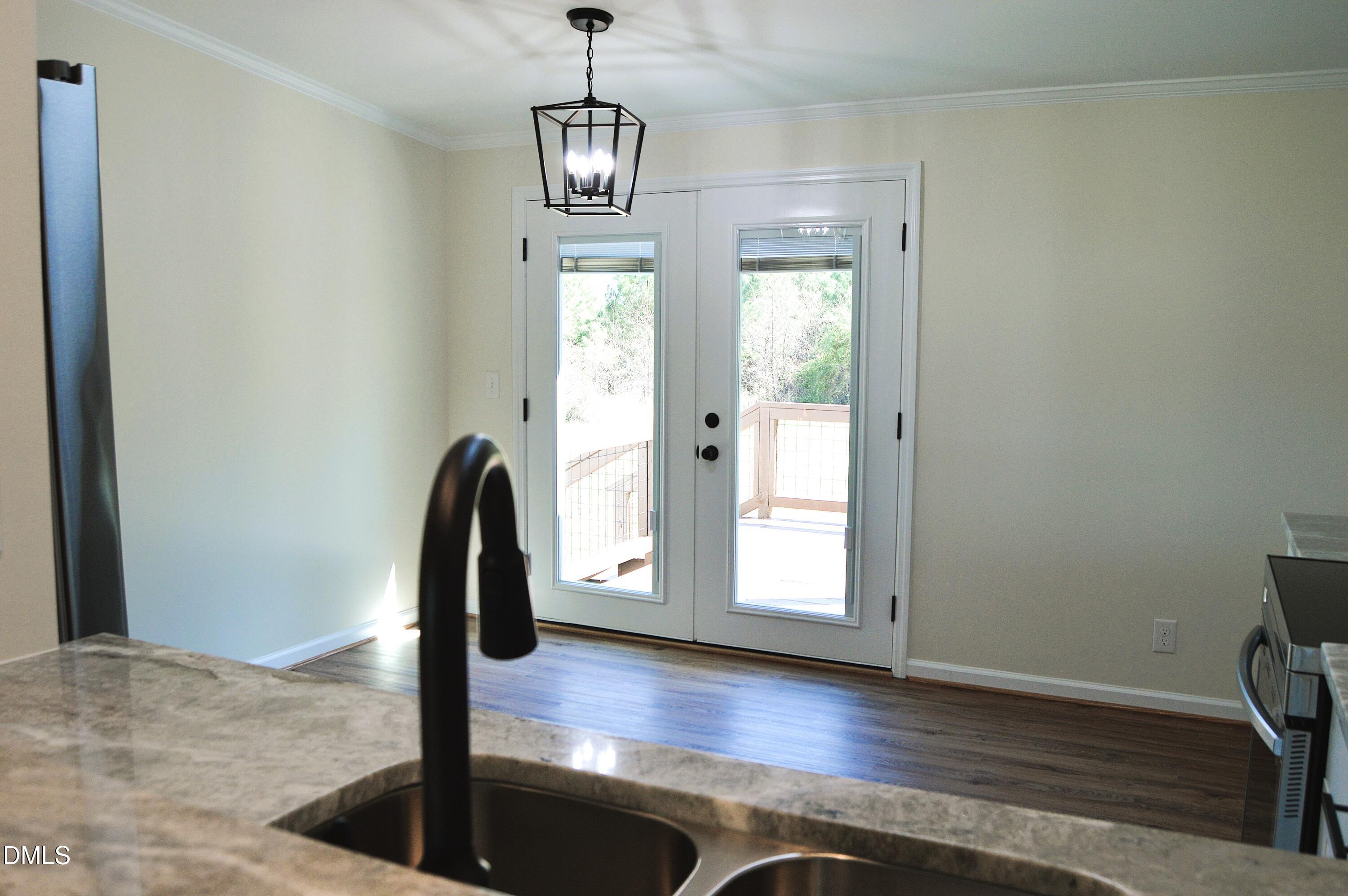 1159 No Bottom Road Warrenton, NC 27589 - Photo 12 of 43 a view of a livingroom with wooden floor and staircase